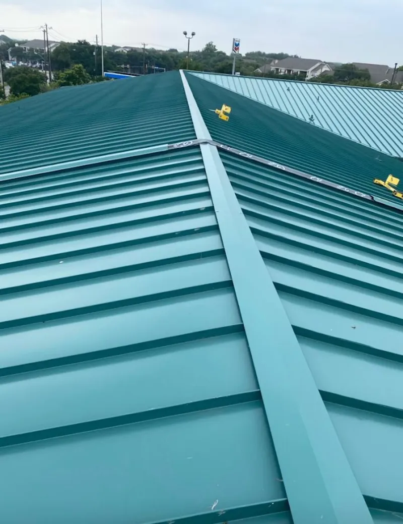 Green commercial metal roof ridge and valley for Metal Roof Repair in Burlington